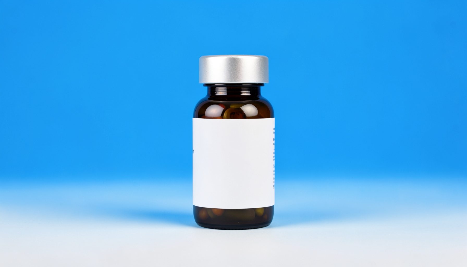 A weight loss supplement bottle with a silver cap on a light neutral backdrop, clean studio lighting.